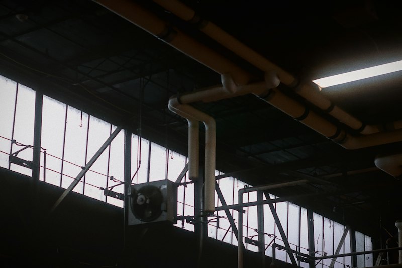 Industrial building interior with pipework