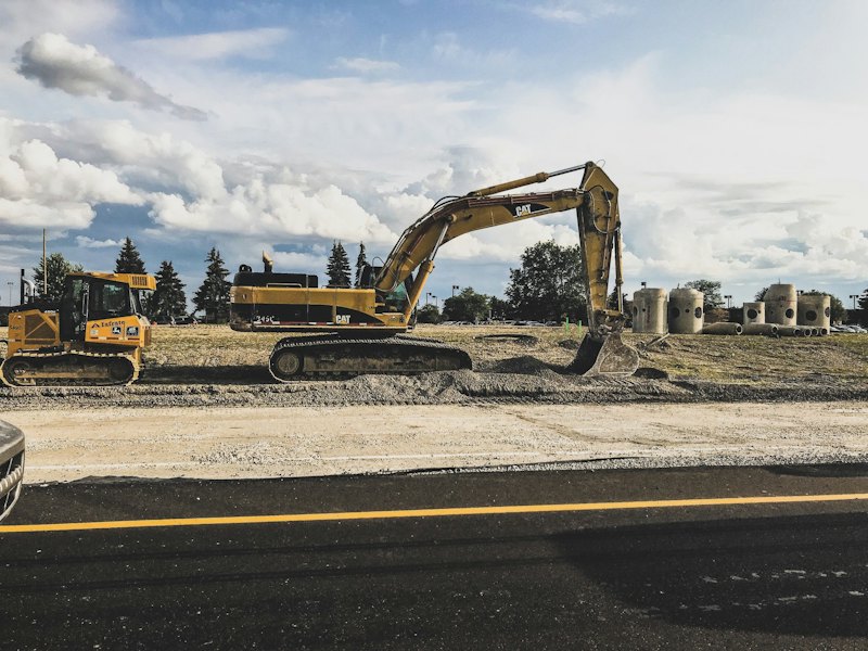 Excavator working on a road site