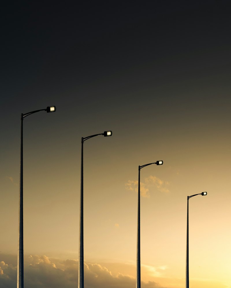 Row of street lights at dusk