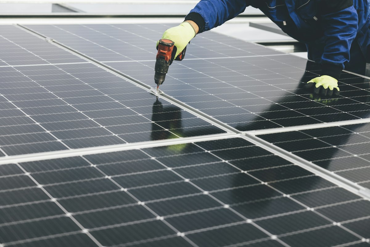Engineer installing solar panels